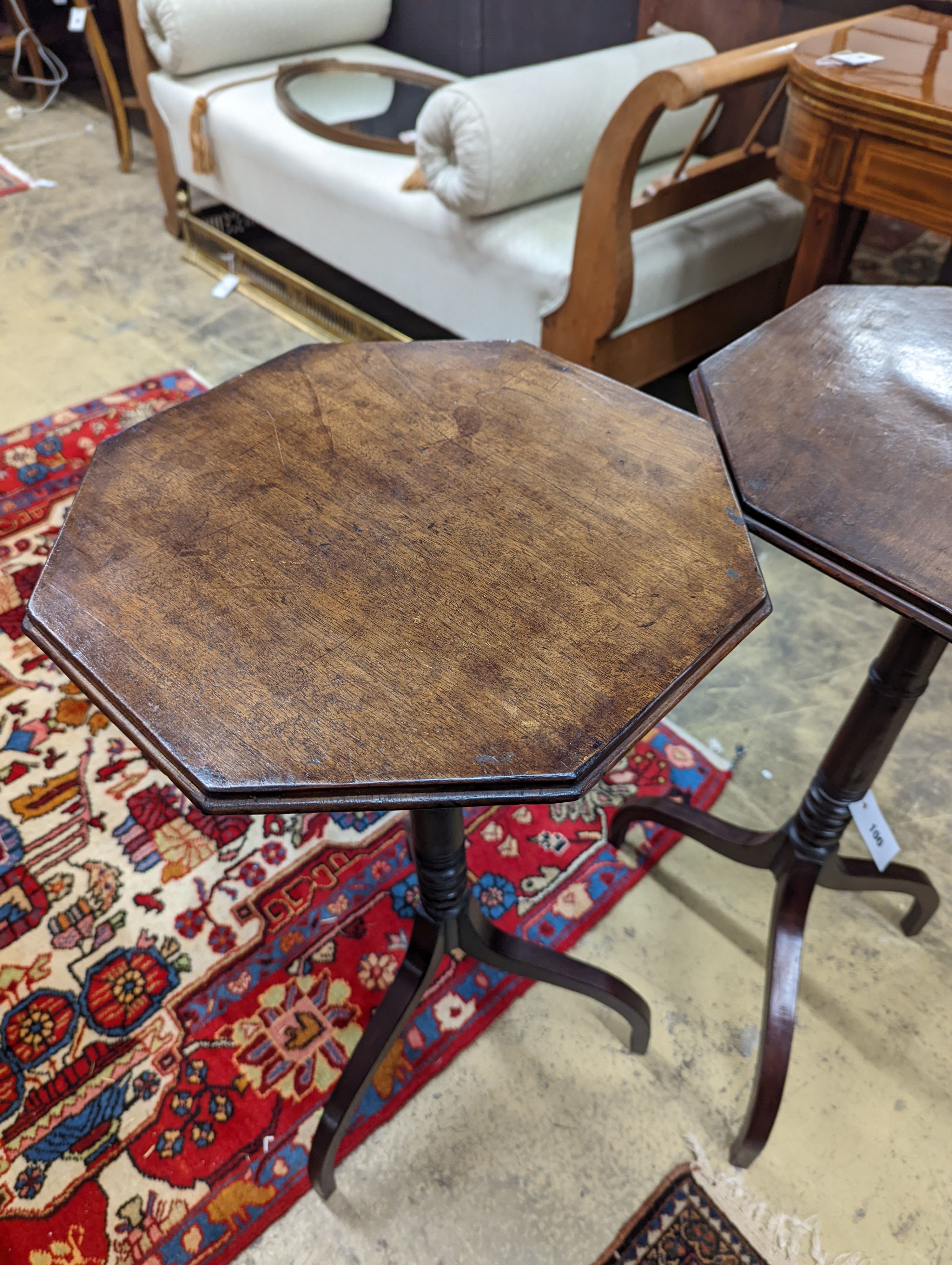 A pair of Regency style mahogany octagonal tripod wine tables, width 38cm, height 77cm